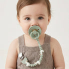 Attache-suce bébé en silicone – Itzy Paci Strap Plus™ Oie -Accessoires bébé- Boutique LeoLudo-Itzy Ritzy Canada