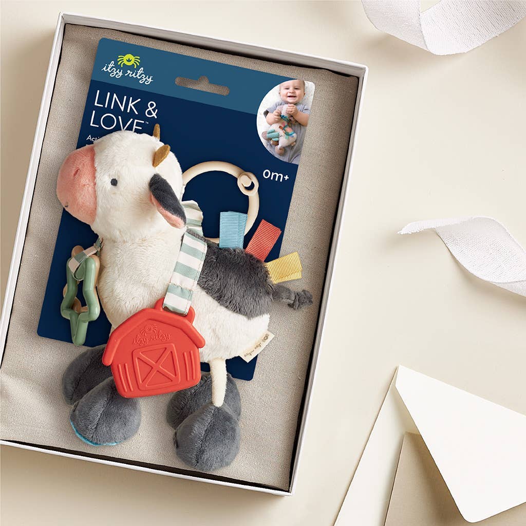 Peluche d’activités sensorielle bébé – Vache Itzy Friends Link & Love™ - Jouets d'éveil - Boutique LeoLudo - Itzy Ritzy Canada