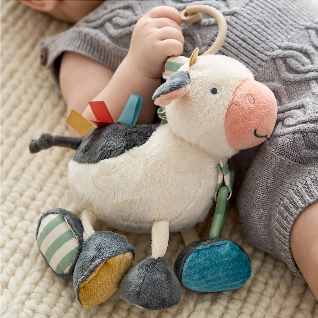 Peluche d’activités sensorielle bébé – Vache Itzy Friends Link & Love™ - Jouets d'éveil - Boutique LeoLudo - Itzy Ritzy Canada