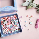 Perles en bois à enfiler - Arc - en - ciel (400 pcs) - Jeux de motricité fine - Boutique LeoLudo - Djeco